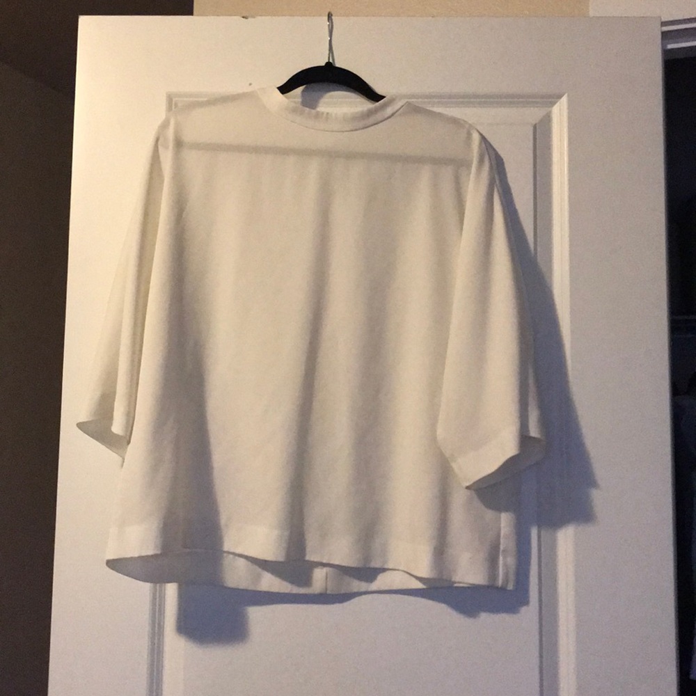 White cowl-neck blouse